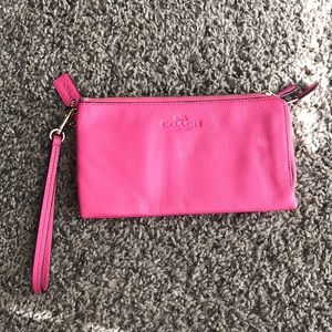 Pink coach leather double zipper wristlet.